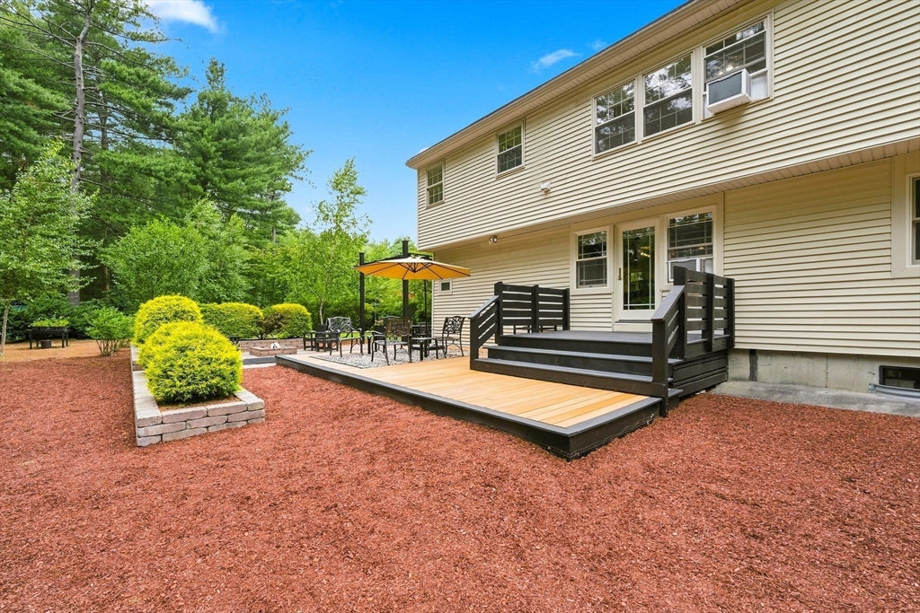 90 Rounsevell Road Tewksbury, MA 01876 - Photo 29 of 42 a view of backyard with swimming pool and furniture