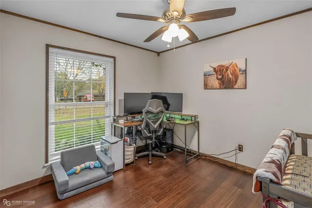 a view of workspace with wooden floor windows and piano