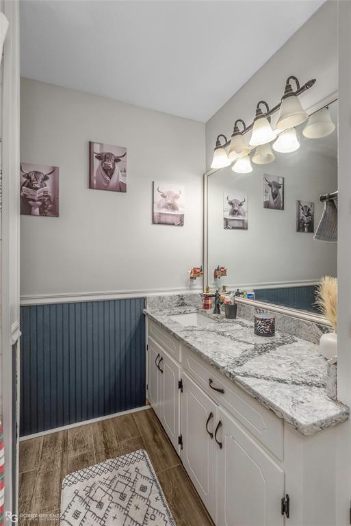 3237 Pinehaven Lane Haughton, LA 71037 - Photo 12 of 16 a bathroom with a granite countertop sink a mirror and vanity
