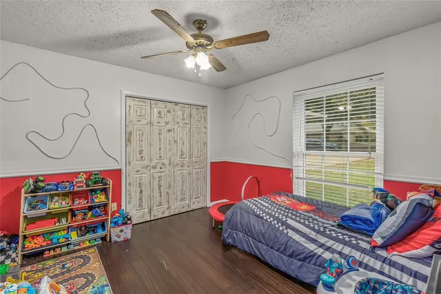 a bedroom with furniture and a window