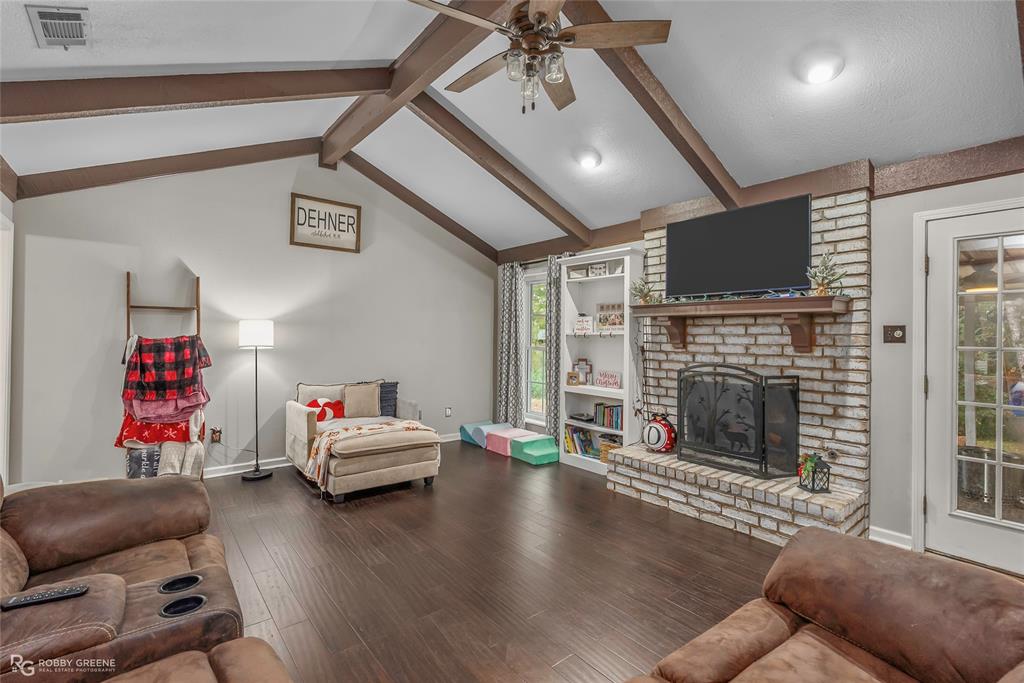 3237 Pinehaven Lane Haughton, LA 71037 - Photo 2 of 16 a living room with furniture fireplace and flat screen tv