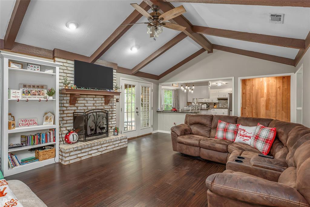 3237 Pinehaven Lane Haughton, LA 71037 - Photo 3 of 16 a living room with furniture fireplace and flat screen tv