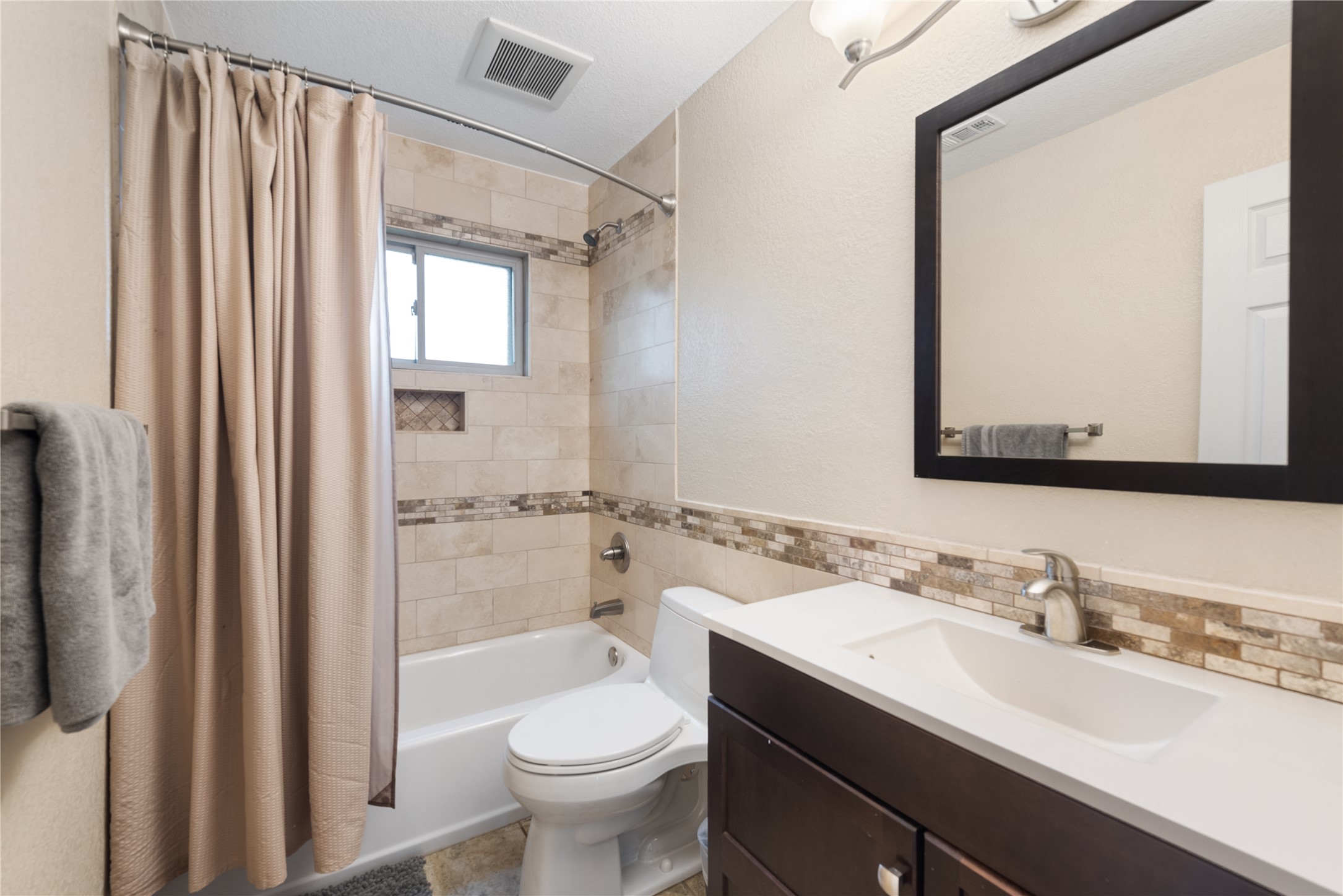 3608 Cookstown Drive Austin, TX 78759 - Photo 13 of 22 a bathroom with a sink toilet a mirror and shower