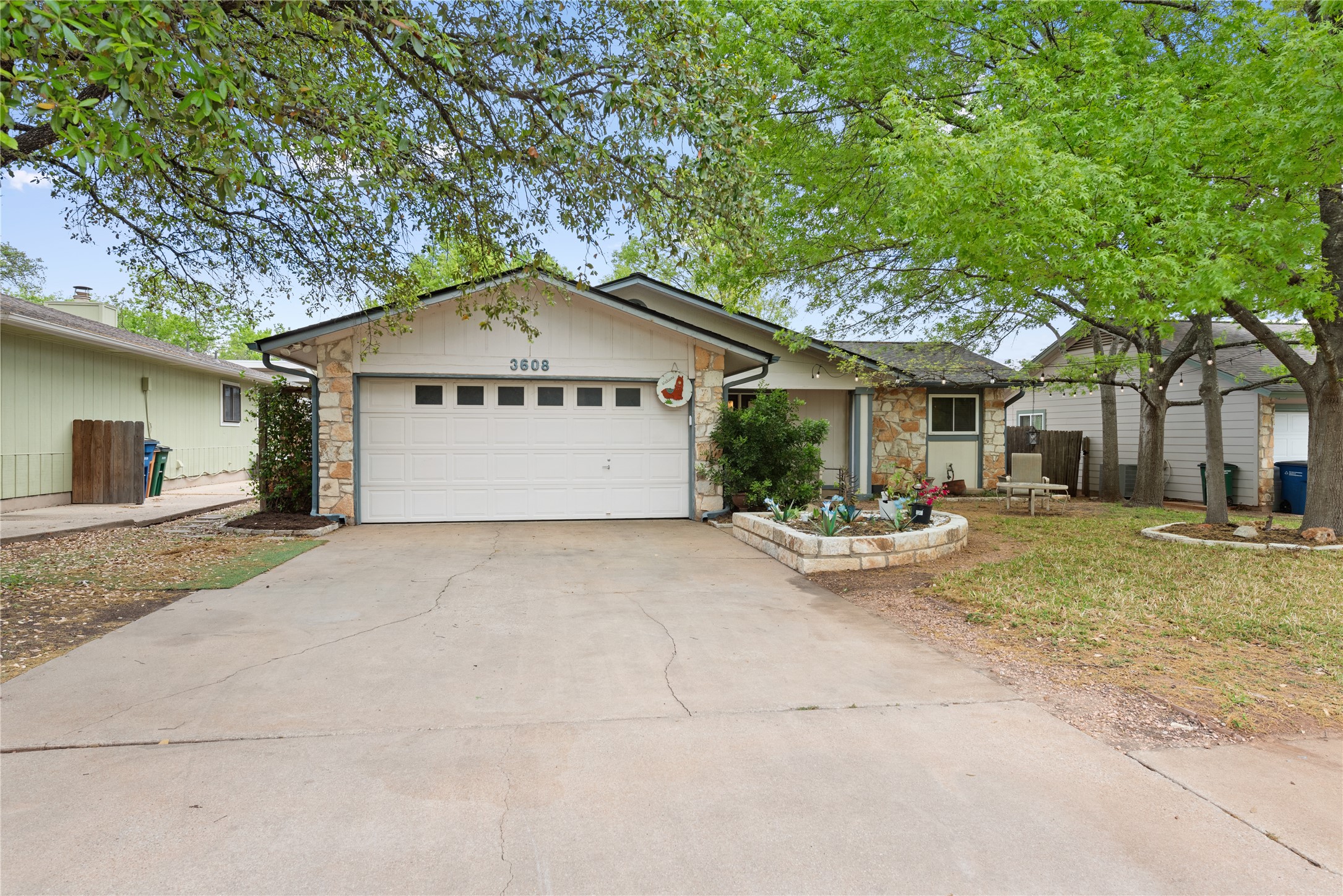 3608 Cookstown Drive Austin, TX 78759 - Photo 18 of 22 a view of patio with a table and chairs under an umbrella