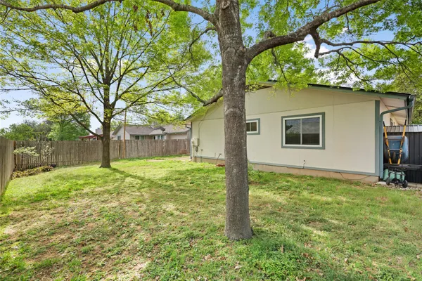 a view of backyard with slide and a slide