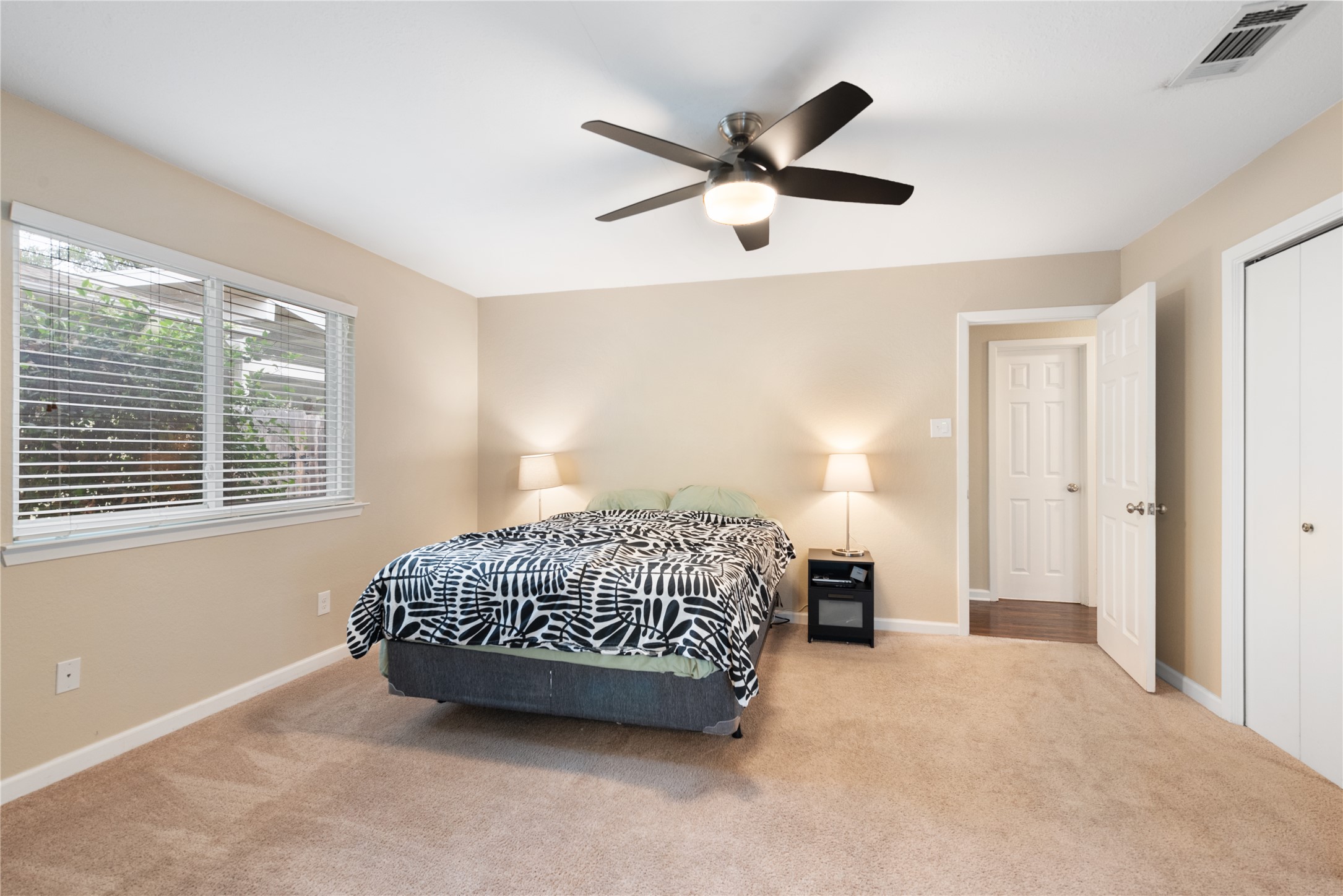 3608 Cookstown Drive Austin, TX 78759 - Photo 8 of 22 a bedroom with a bed and a large window