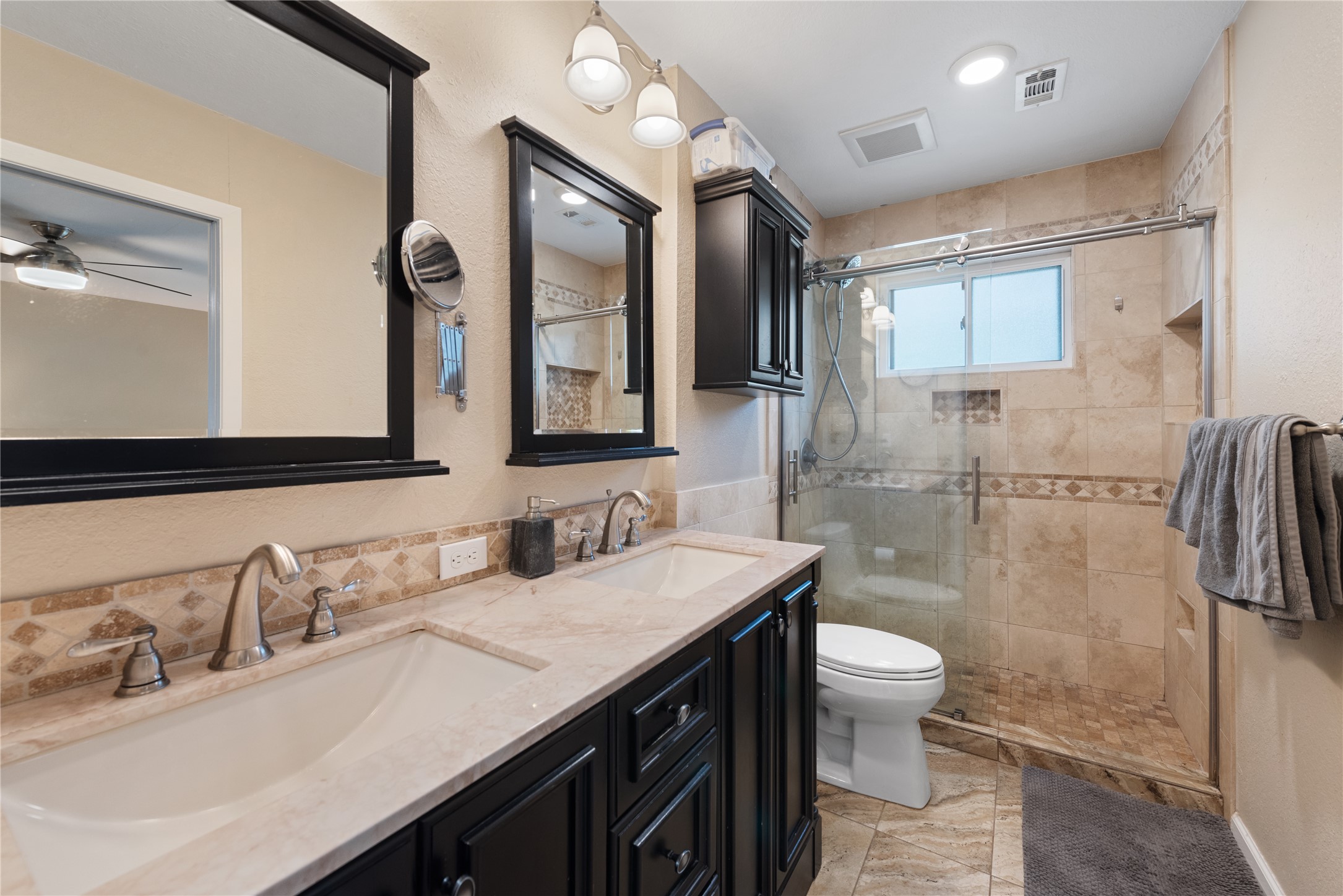 3608 Cookstown Drive Austin, TX 78759 - Photo 9 of 22 a bathroom with a sink double vanity and a toilet