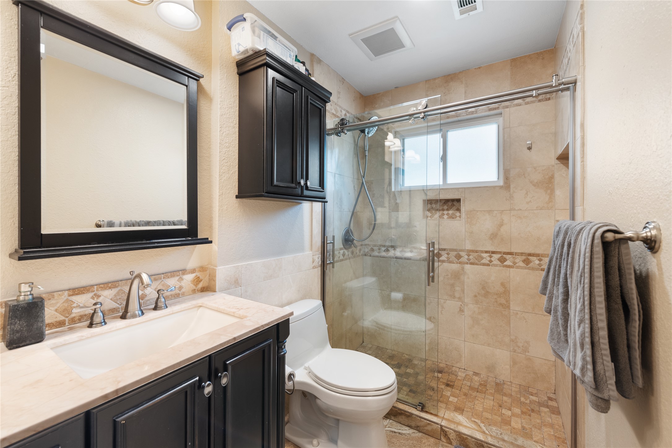 3608 Cookstown Drive Austin, TX 78759 - Photo 10 of 22 a bathroom with a granite countertop sink toilet and shower