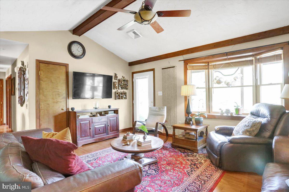 799 Gibraltar Road Reading, PA 19606 - Photo 6 of 35 Vaulted ceilings w/ beam & ceiling fan.