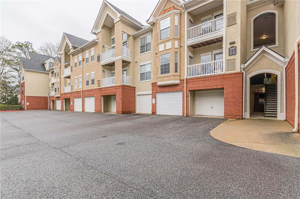 2303 Westchester Ridge Northeast Brookhaven, GA 30329 - Photo 1 of 1 a front view of a building with a road