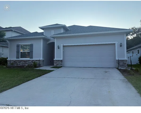 a view of house with yard