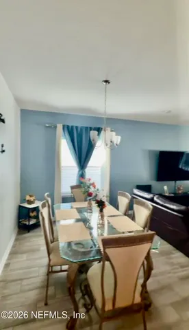 a view of a dining room with furniture