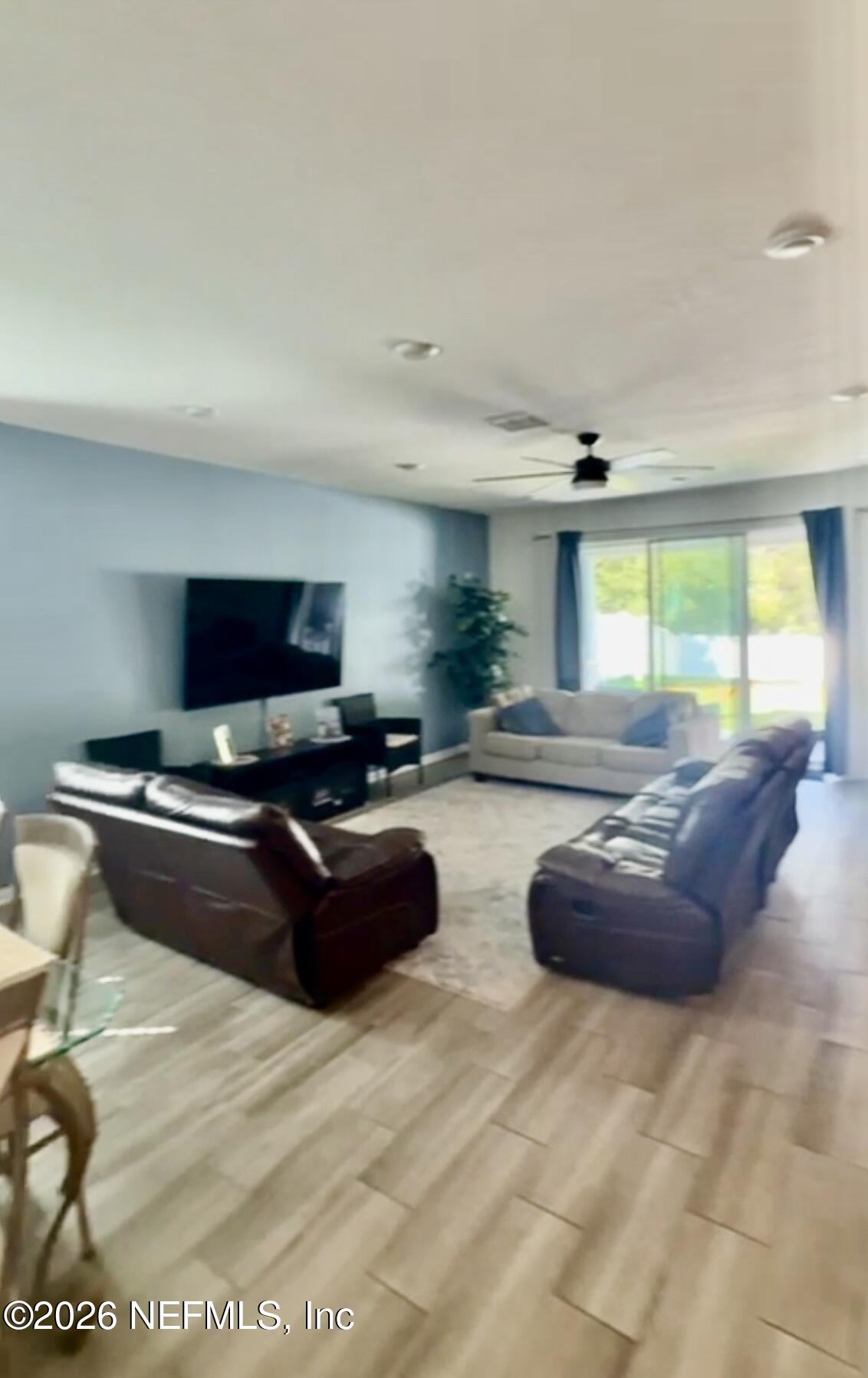 31 Sandstone Drive St. Augustine, FL 32086 - Photo 5 of 9 a living room with furniture and a flat screen tv