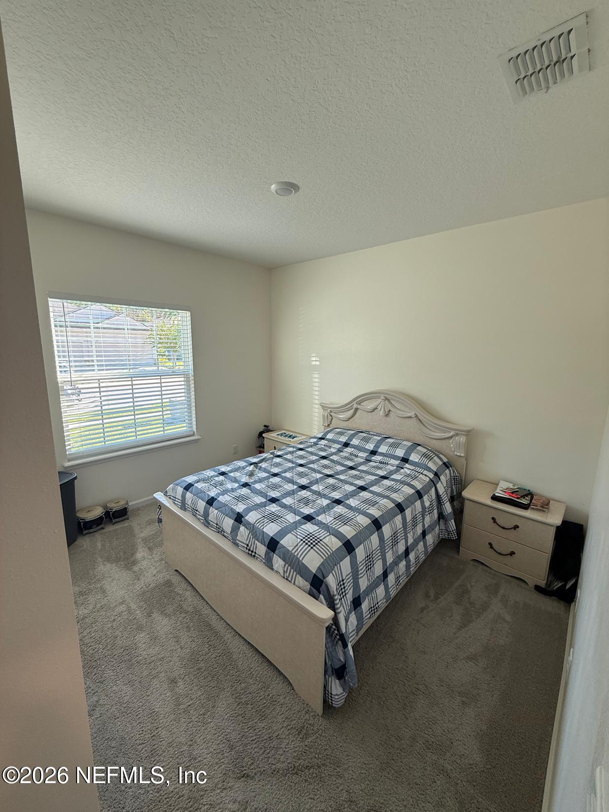 31 Sandstone Drive St. Augustine, FL 32086 - Photo 6 of 9 a bedroom with a bed and window