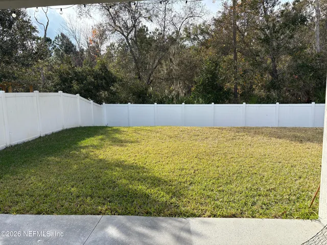 a view of a swimming pool and trees