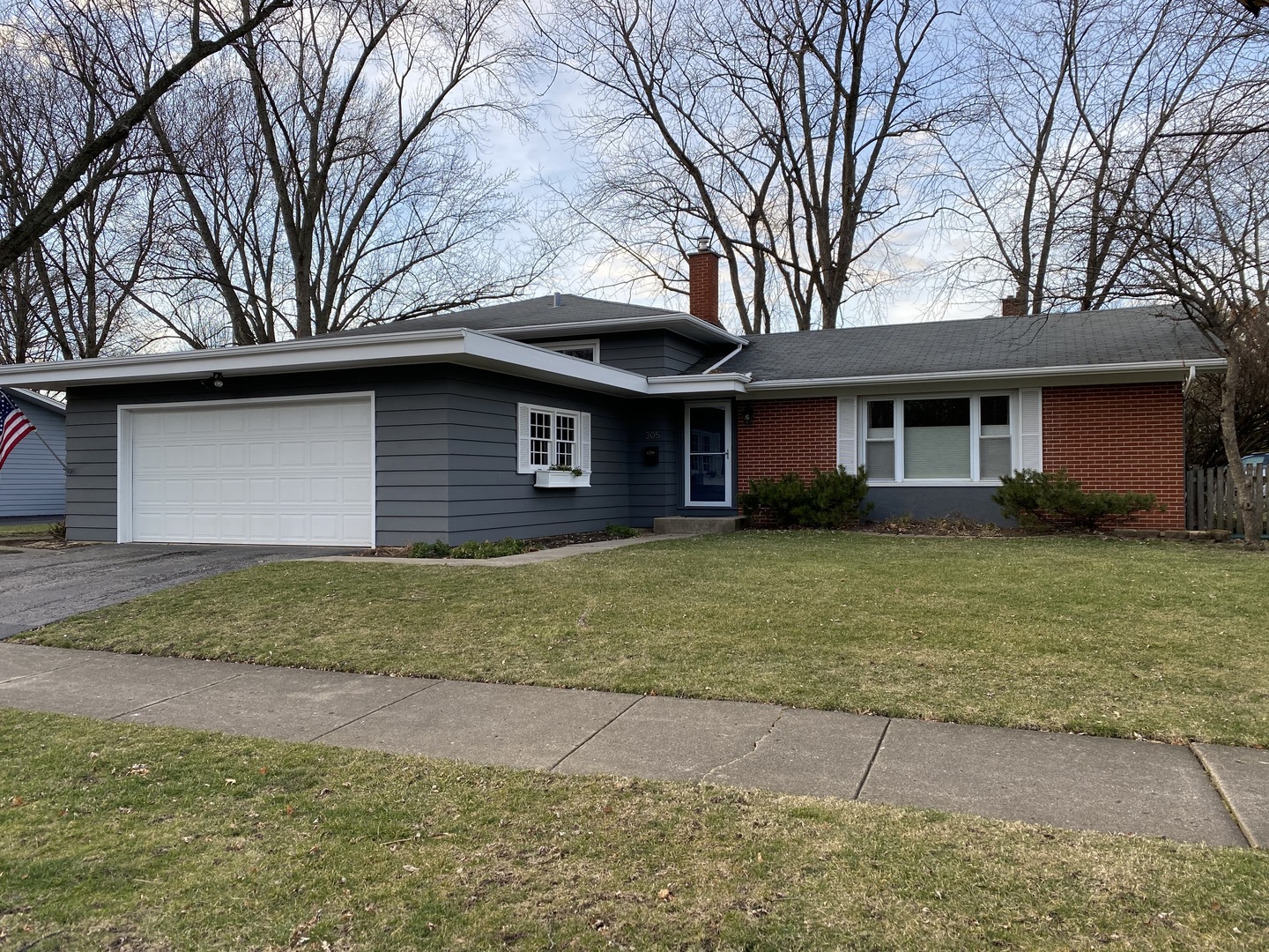 305 West Gartner Road Naperville, IL 60540 - Photo 1 of 20 a front view of a house with a garden