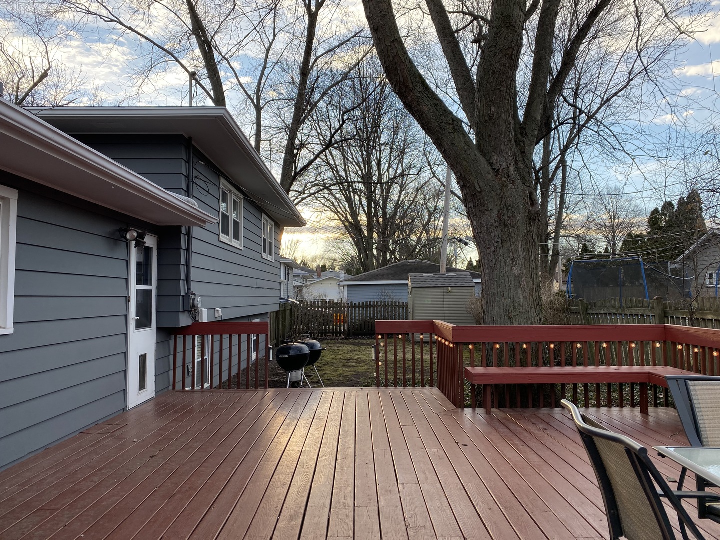 305 West Gartner Road Naperville, IL 60540 - Photo 19 of 20 a view of a roof deck with wooden floor and fence