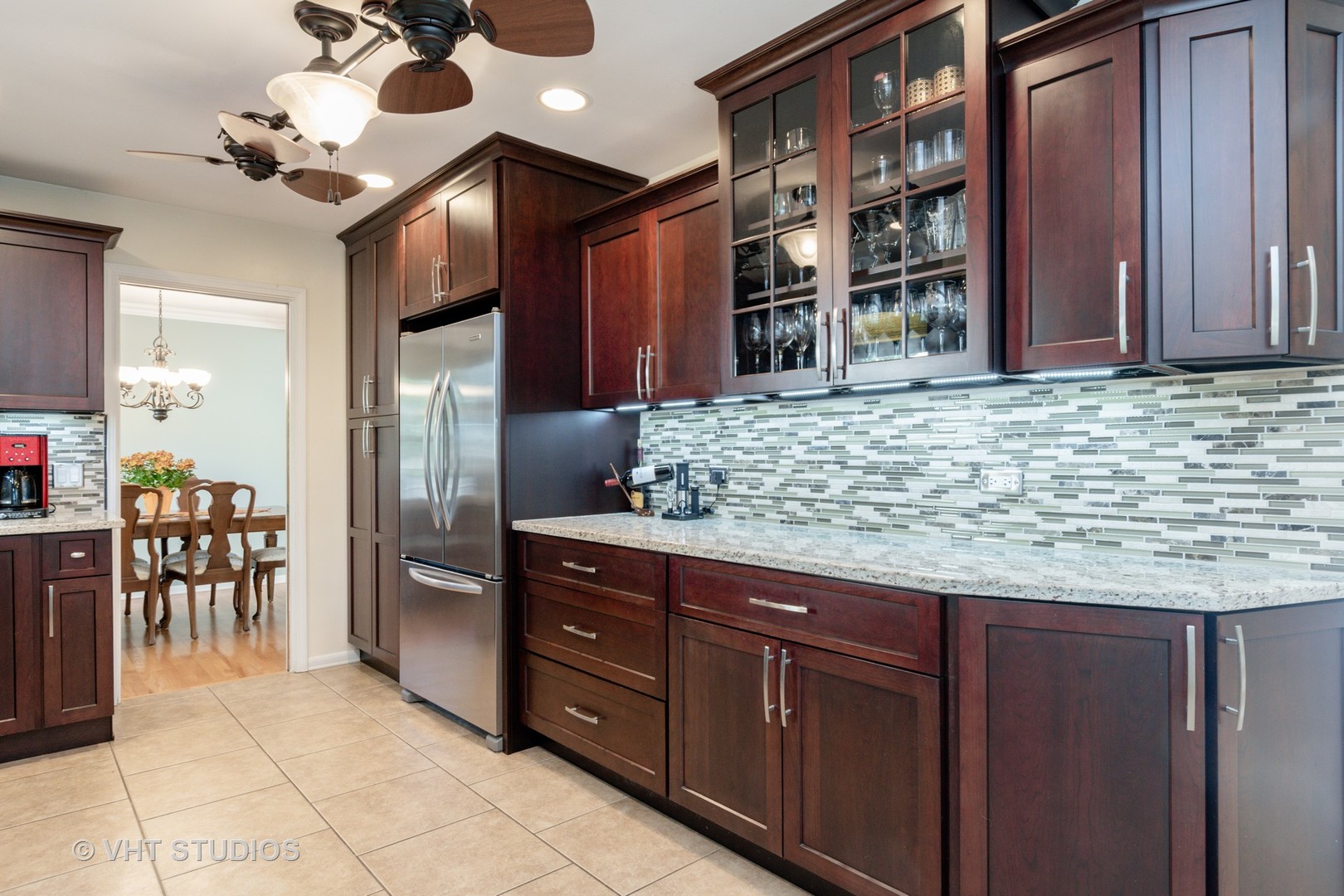 305 West Gartner Road Naperville, IL 60540 - Photo 6 of 20 a kitchen with a cabinets and chairs