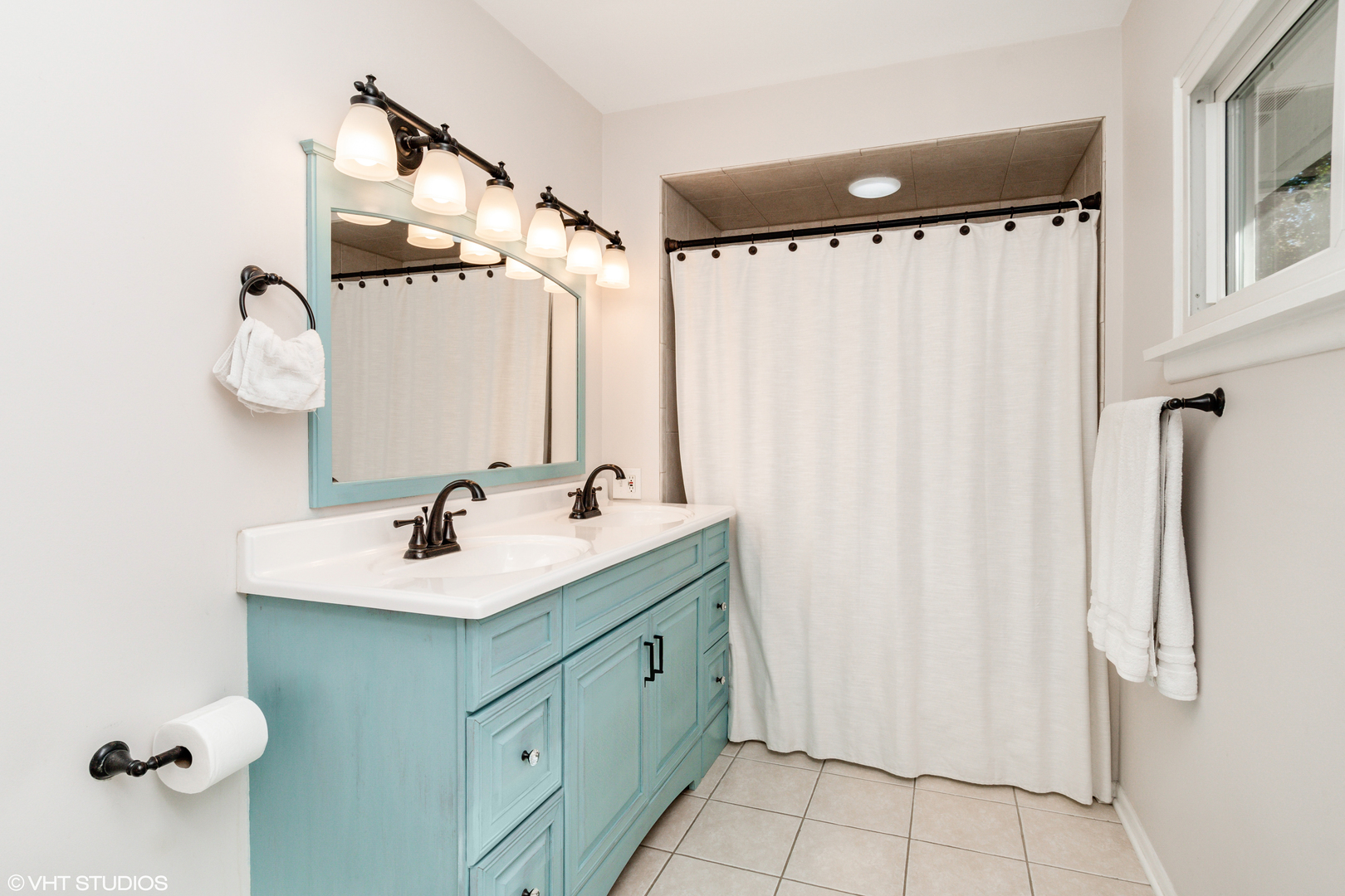 305 West Gartner Road Naperville, IL 60540 - Photo 10 of 20 a bathroom with a sink vanity and a mirror