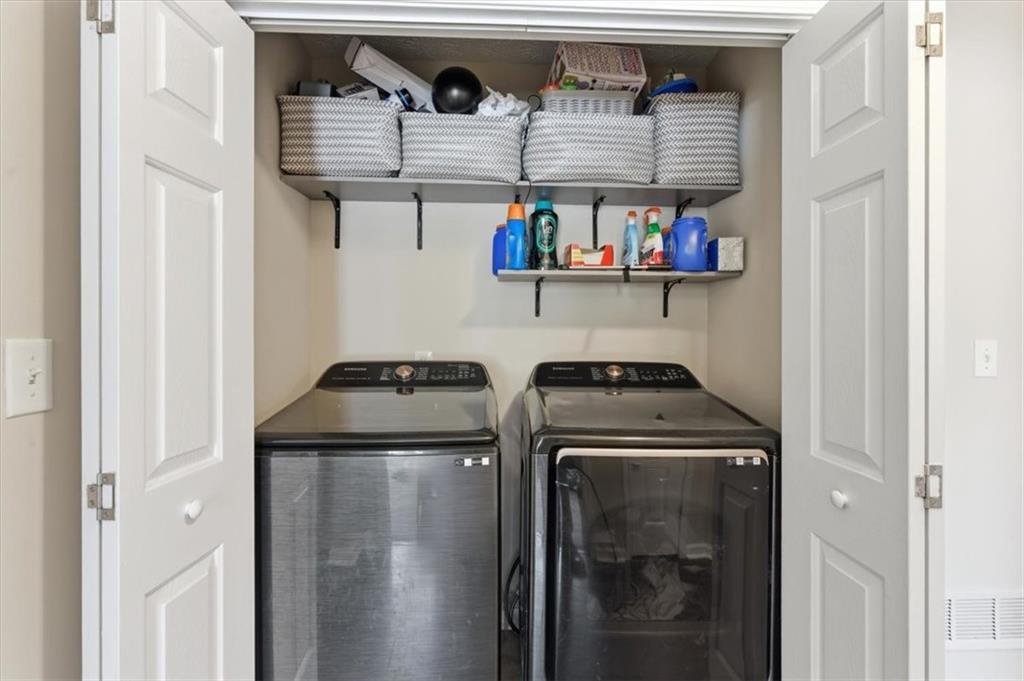 101 Brookcliff Court Temple, GA 30179 - Photo 14 of 48 a kitchen with stainless steel appliances granite countertop a stove and a refrigerator