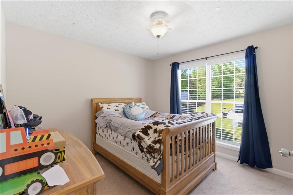 101 Brookcliff Court Temple, GA 30179 - Photo 16 of 48 a bedroom with a bed and a window