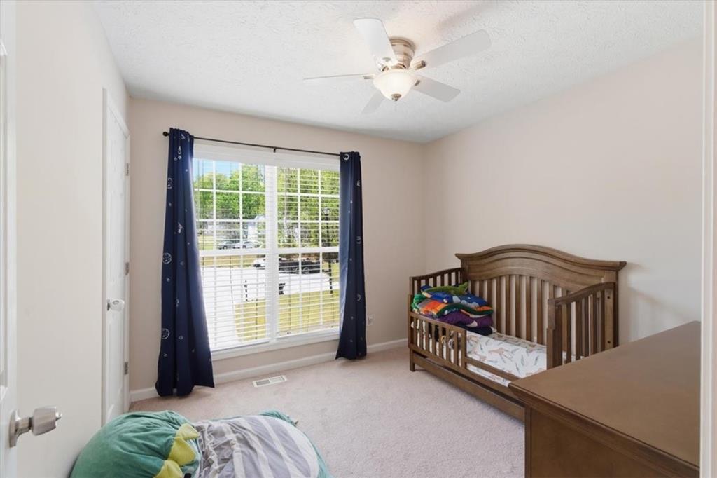 101 Brookcliff Court Temple, GA 30179 - Photo 17 of 48 a bedroom with a bed and a window