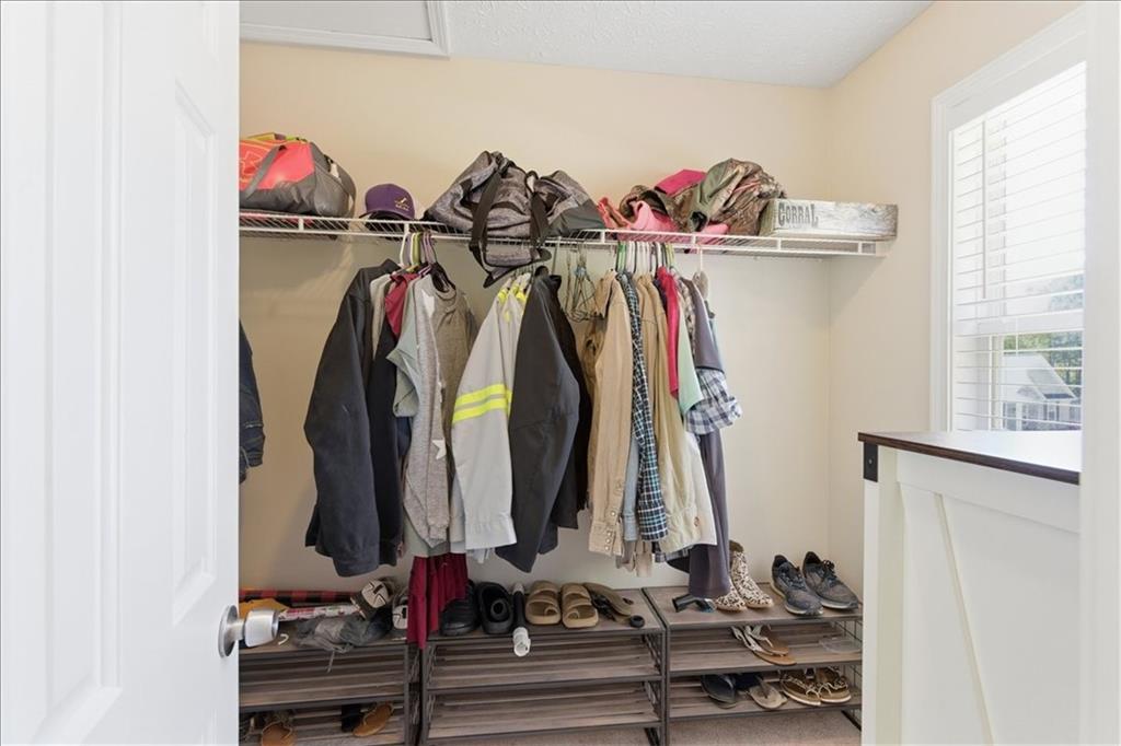 101 Brookcliff Court Temple, GA 30179 - Photo 22 of 48 a view of walk in closet with clothes