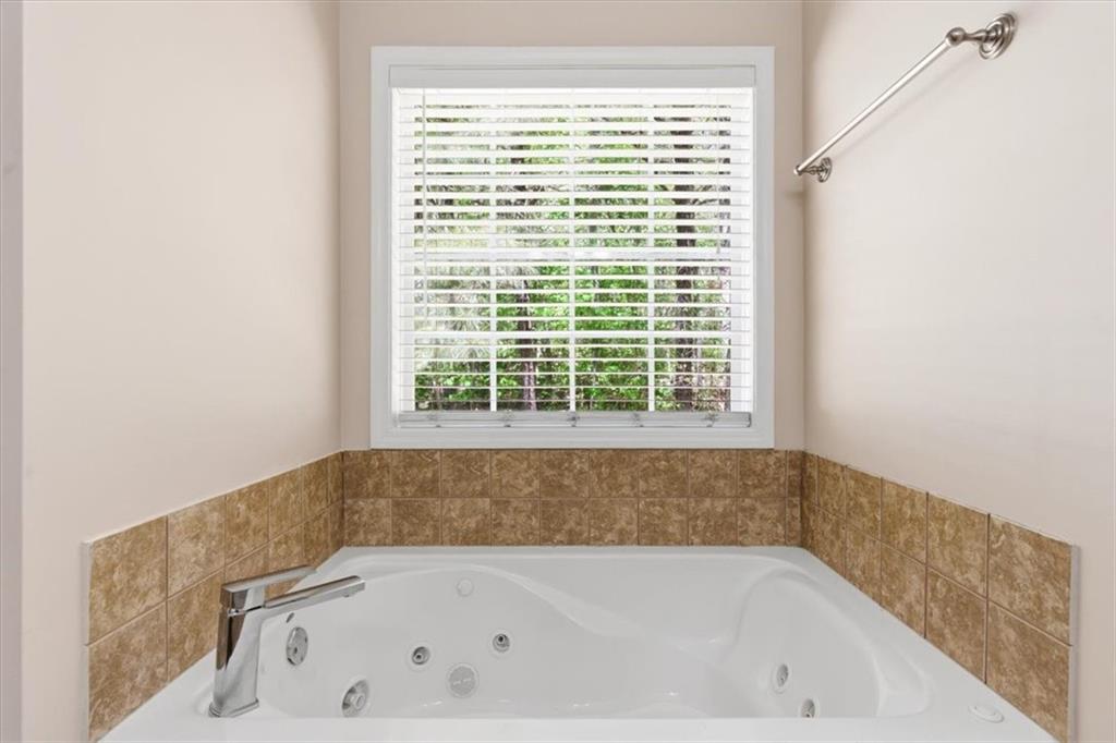 101 Brookcliff Court Temple, GA 30179 - Photo 23 of 48 a bath tub sitting in a bathroom next to a window