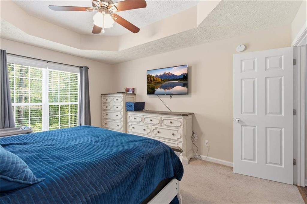 101 Brookcliff Court Temple, GA 30179 - Photo 25 of 48 a bedroom with a bed and a flat screen tv