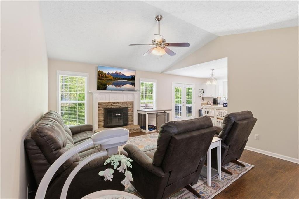 101 Brookcliff Court Temple, GA 30179 - Photo 29 of 48 a living room with furniture a fireplace and a flat screen tv
