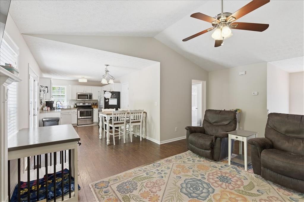 101 Brookcliff Court Temple, GA 30179 - Photo 3 of 48 a living room with furniture kitchen view and a dining table