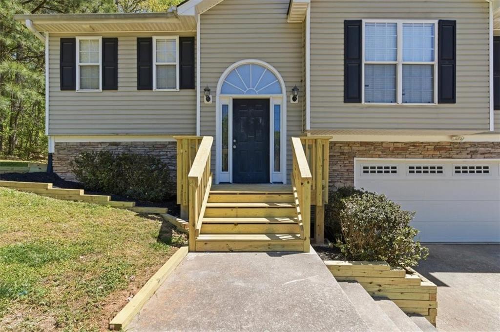 101 Brookcliff Court Temple, GA 30179 - Photo 31 of 48 a front view of a house with a yard and garage