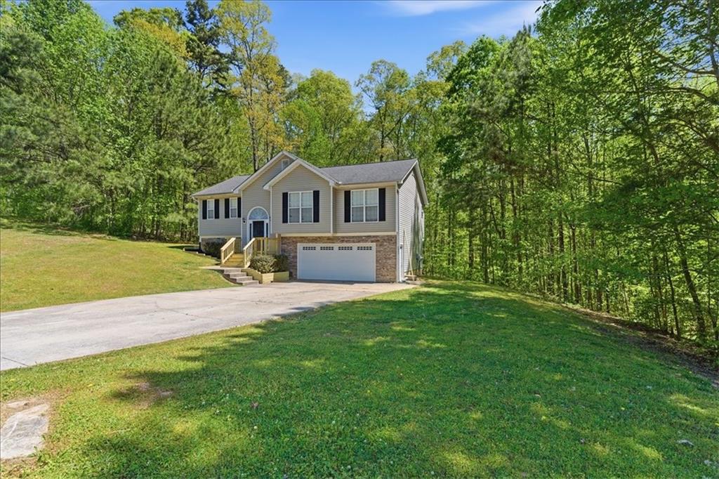 101 Brookcliff Court Temple, GA 30179 - Photo 34 of 48 a view of a house with a big yard plants and large trees