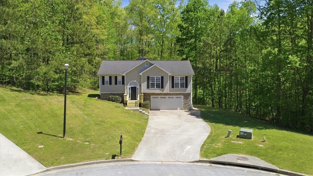 101 Brookcliff Court Temple, GA 30179 - Photo 44 of 48 a front view of a house with garden