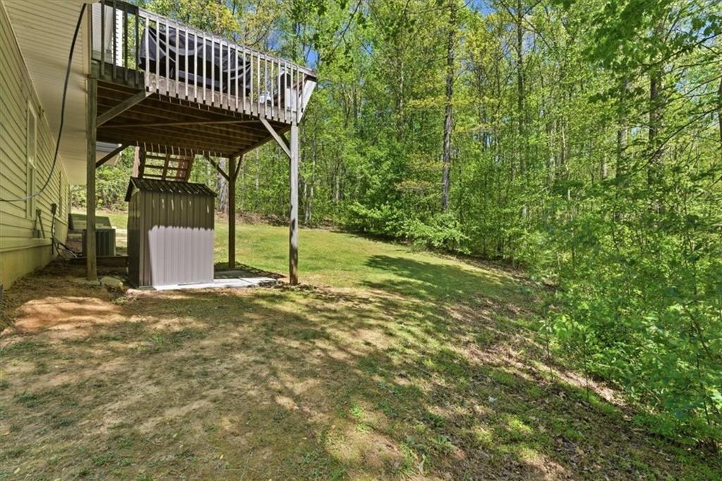 101 Brookcliff Court Temple, GA 30179 - Photo 45 of 48 a view of a wooden deck with a backyard