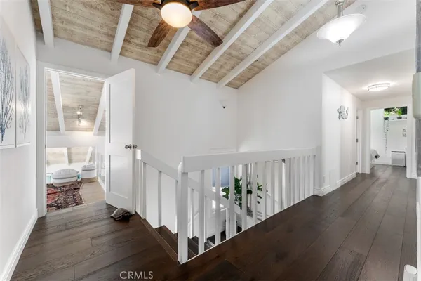 a living room with furniture or couch and a dresser