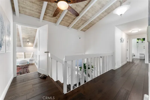 a living room with furniture or couch and a dresser