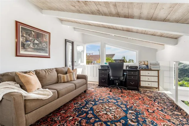 a view of a balcony with an outdoor seating