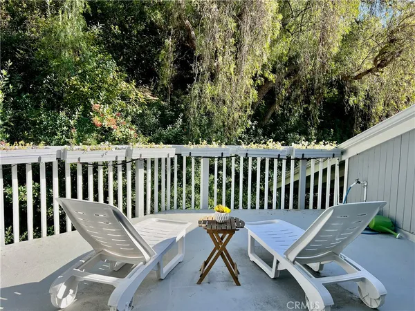a bedroom with a large bed and a large window