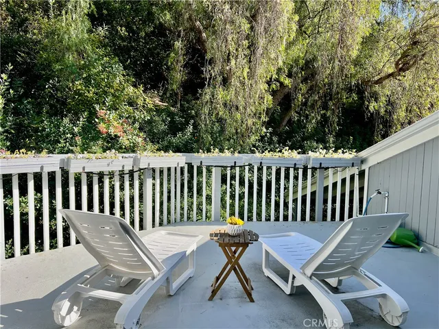 a bedroom with a large bed and a large window