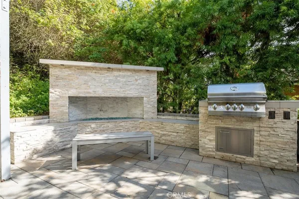 a view of a patio with table and chairs with wooden floor and fence
