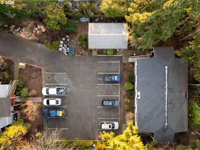 an aerial view of a residential apartment building with a yard