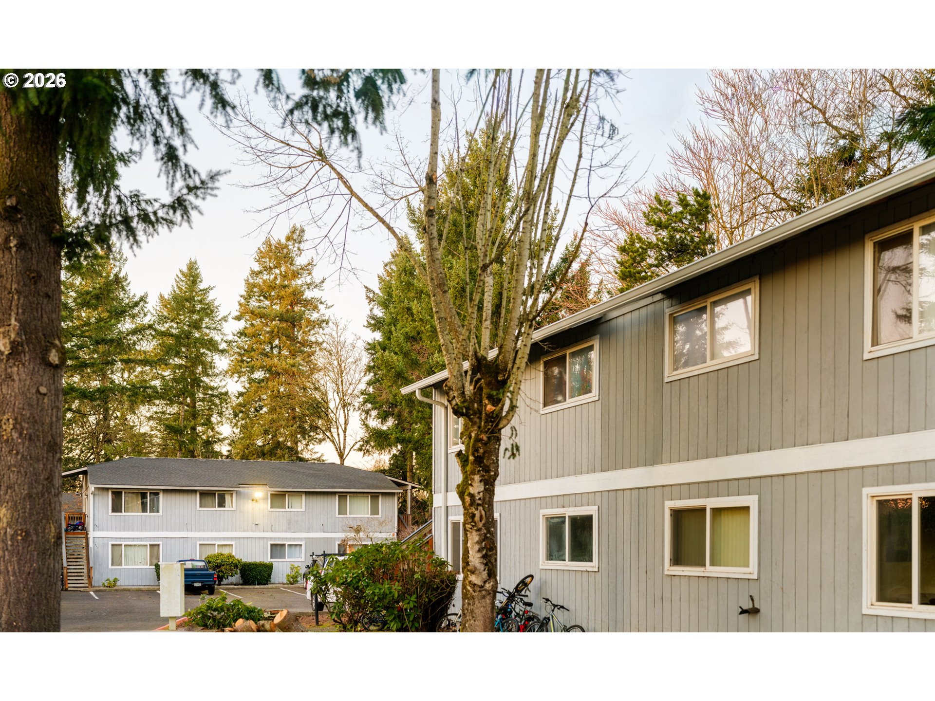340 South Locust Street Canby, OR 97013 - Photo 3 of 21 a view of a house with a tree in the background