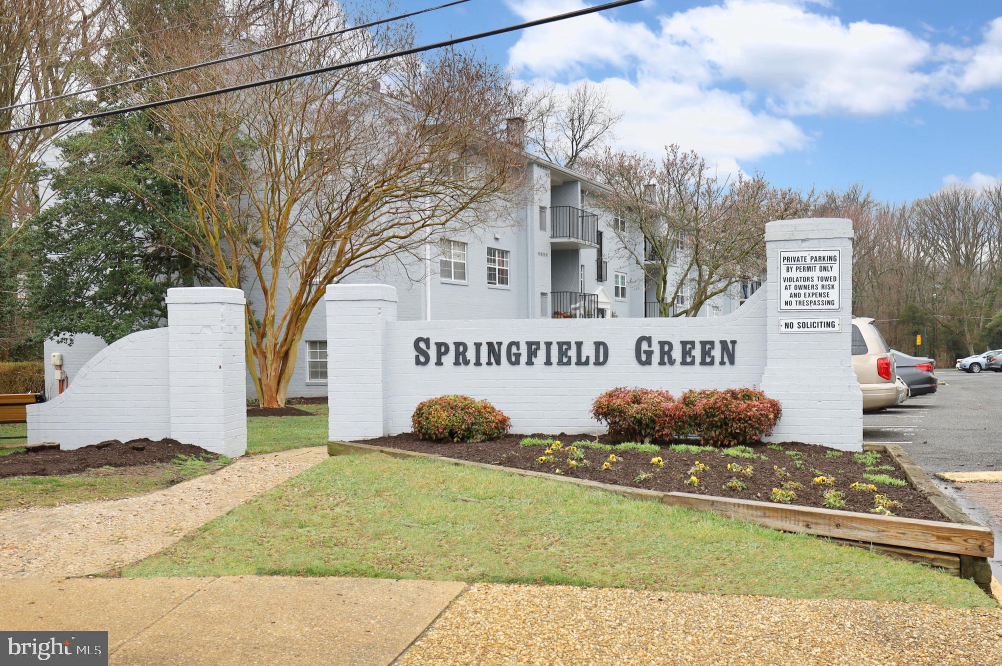 7093 Spring Garden Drive, Unit 101 Springfield, VA 22150 - Photo 2 of 23 a front view of a house with garden