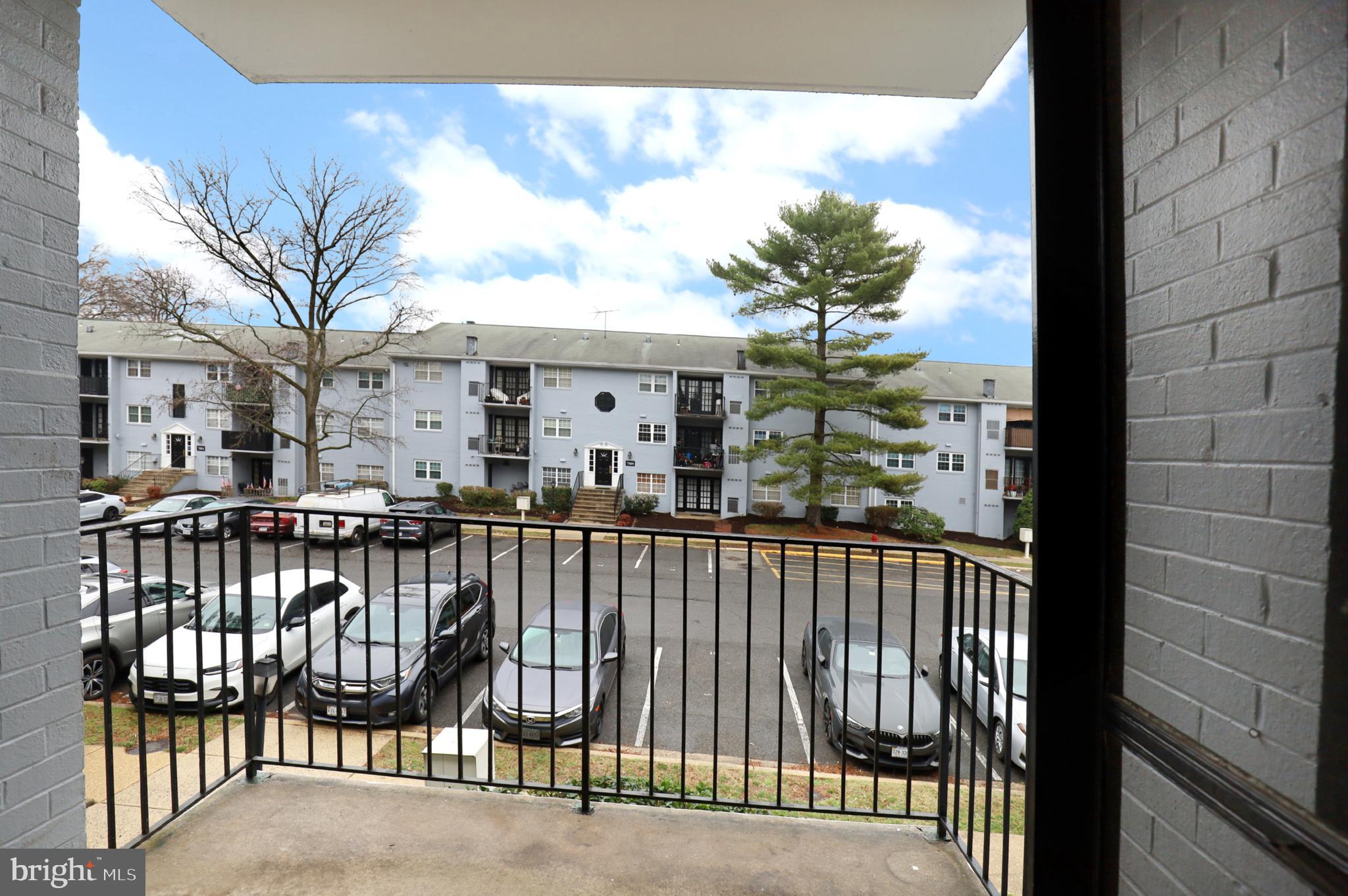7093 Spring Garden Drive, Unit 101 Springfield, VA 22150 - Photo 22 of 23 a view of a balcony with wooden floor