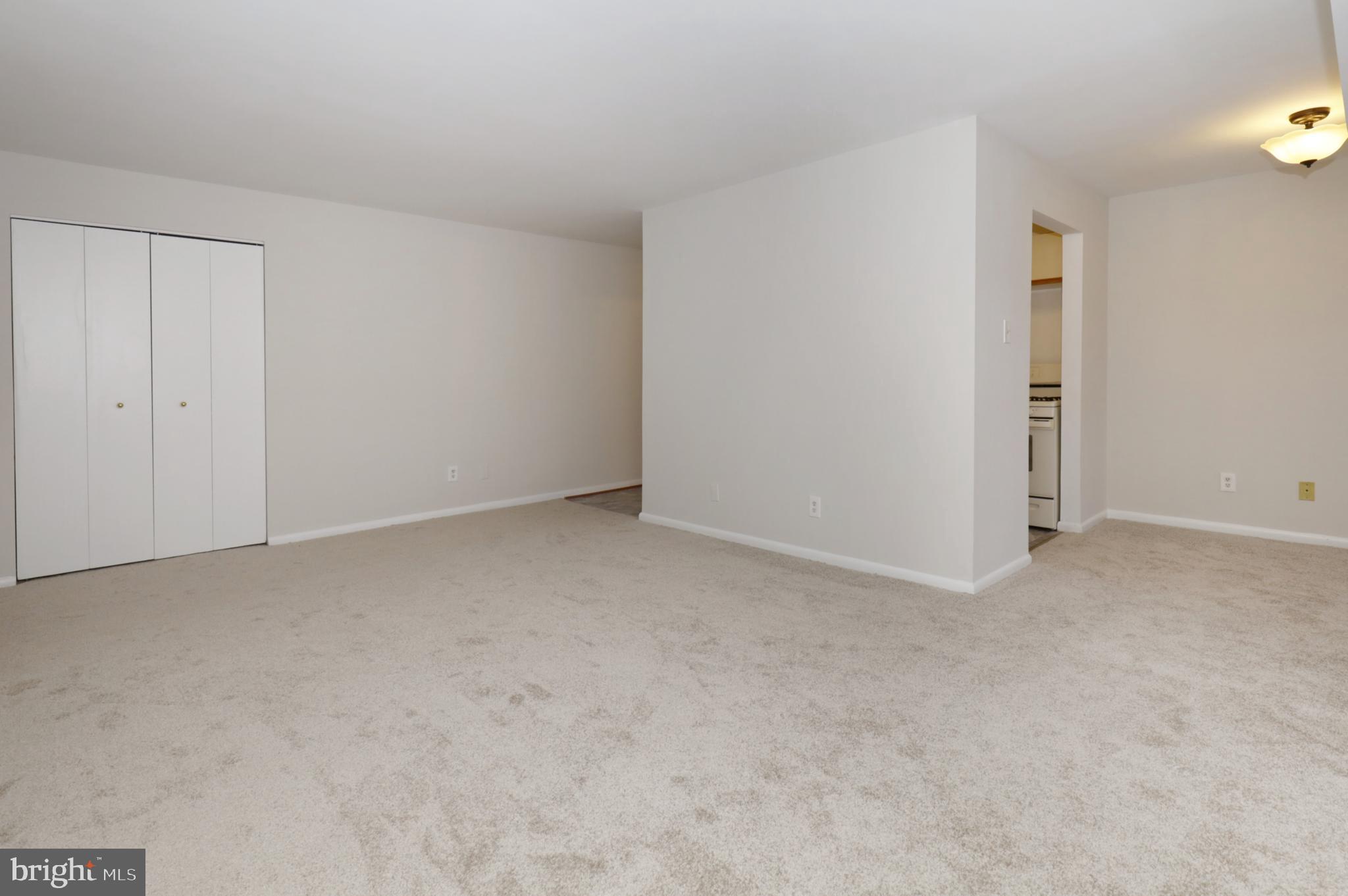 7093 Spring Garden Drive, Unit 101 Springfield, VA 22150 - Photo 7 of 23 a view of an empty room and entryway