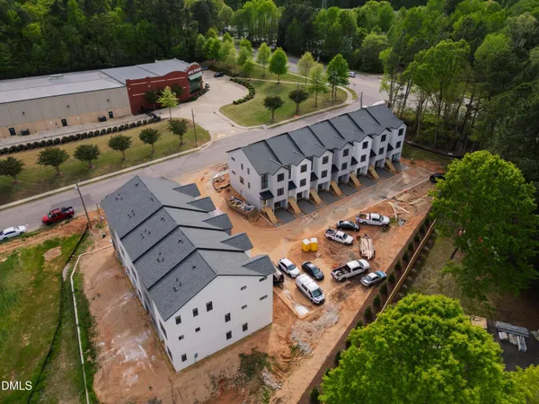 an aerial view of a chairs and table on the patio