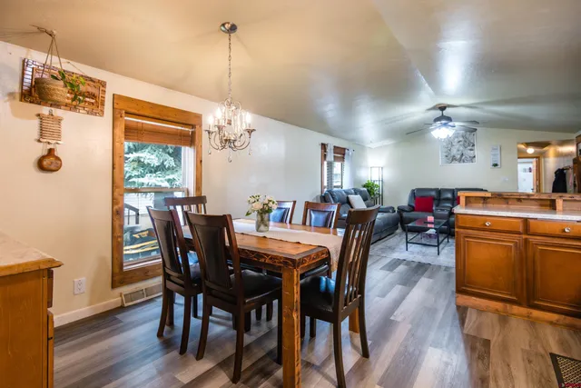 a view of a dining room with furniture window and wooden floor