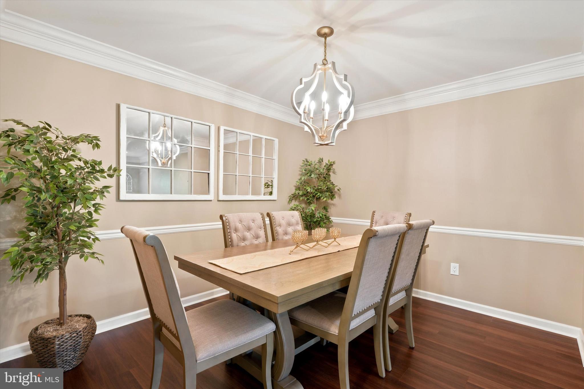215 Flagstone Road, Unit 1 Chester Springs, PA 19425 - Photo 11 of 33 a view of a dining room with furniture a chandelier and wooden floor