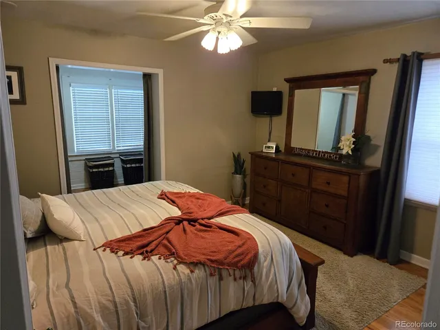 a bedroom with a bed and a dresser